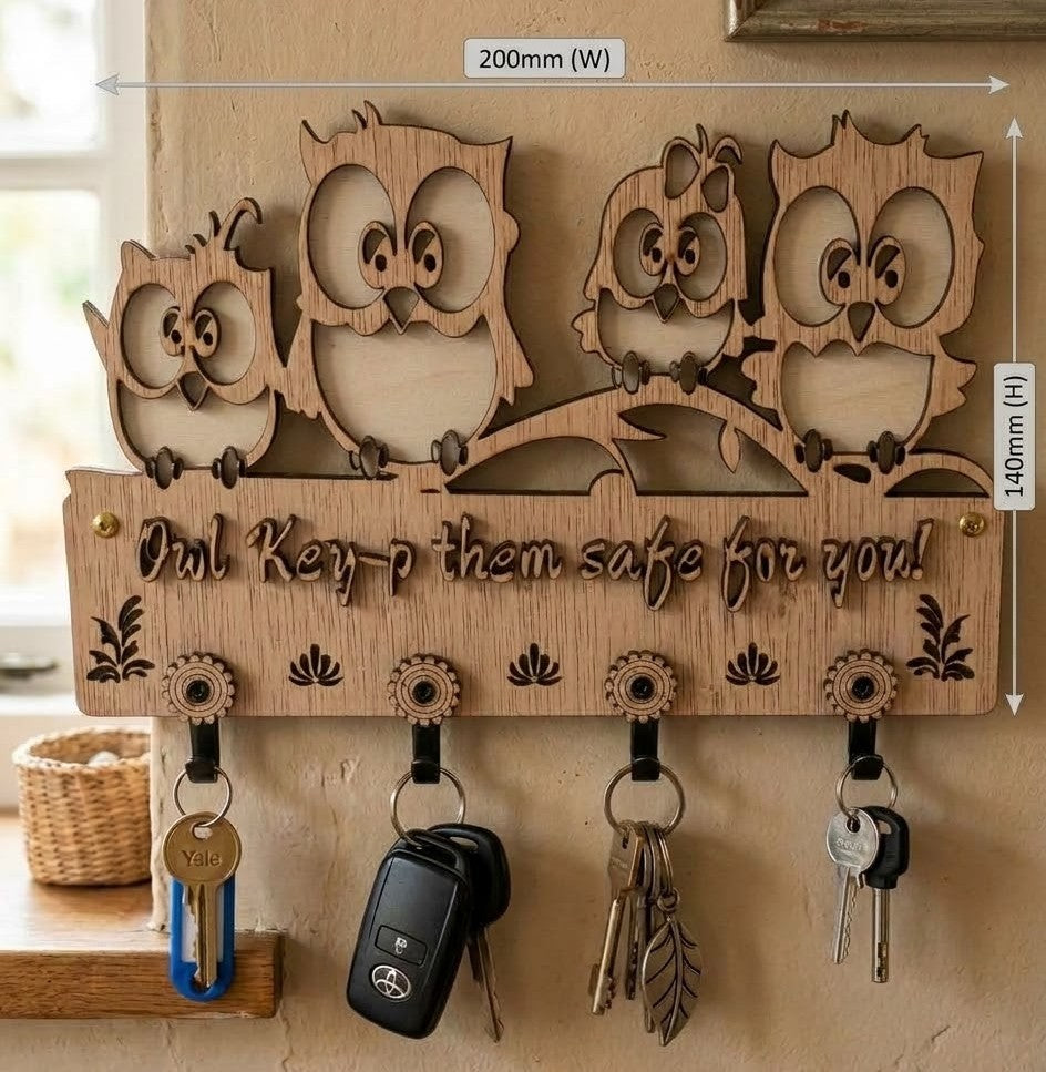Owl design wooden key holder mounted on a wall with keys hanging from the hooks